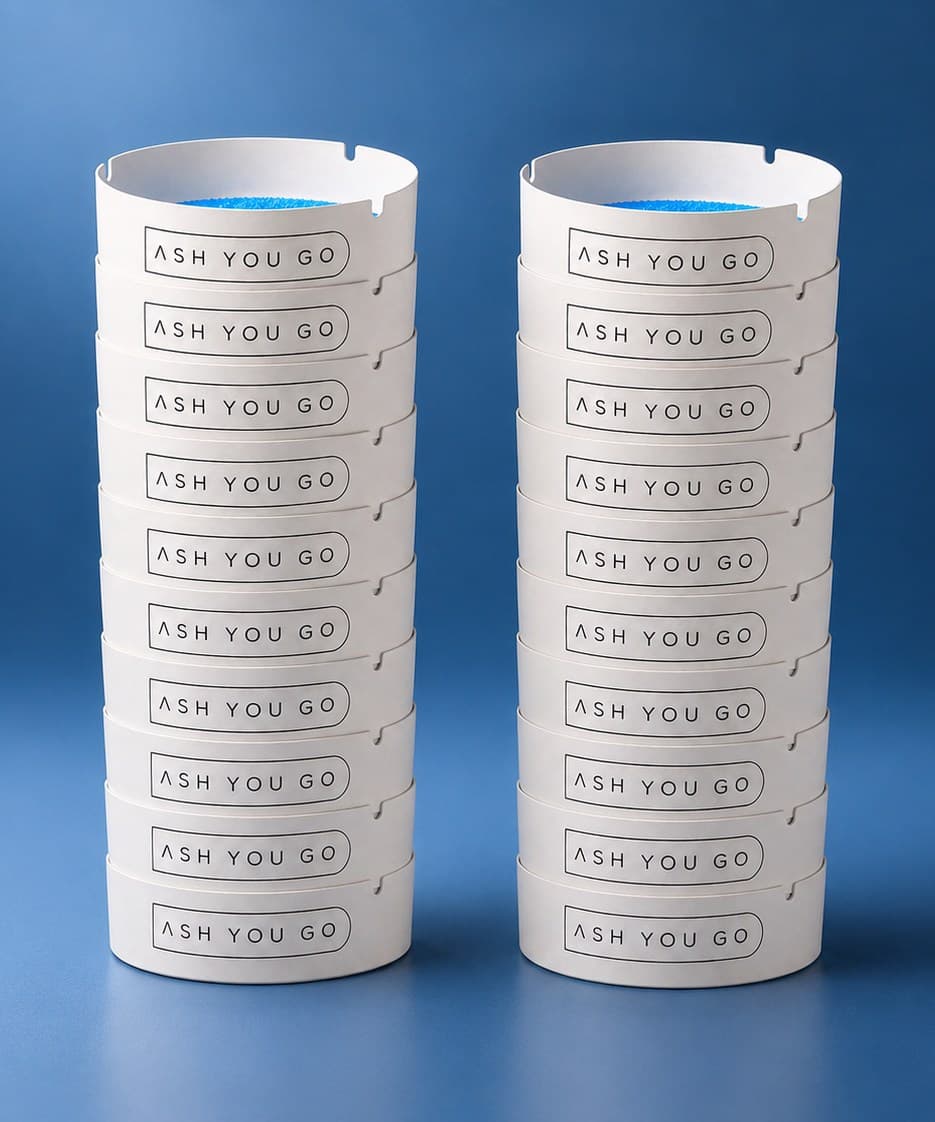 Two stacks of 10 ASH YOU GO trays on a deep blue backdrop