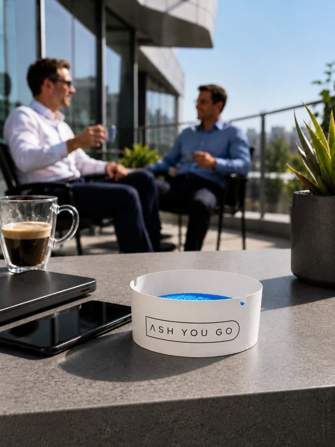 Colleagues on an office terrace with an ASH YOU GO tray